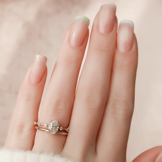 1.24 Carat Oval Moissanite Bridal Set with Round Cut Side Stones