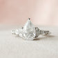 2.01 Ct Pear Moissanite With Marquise & Round Engagement Ring