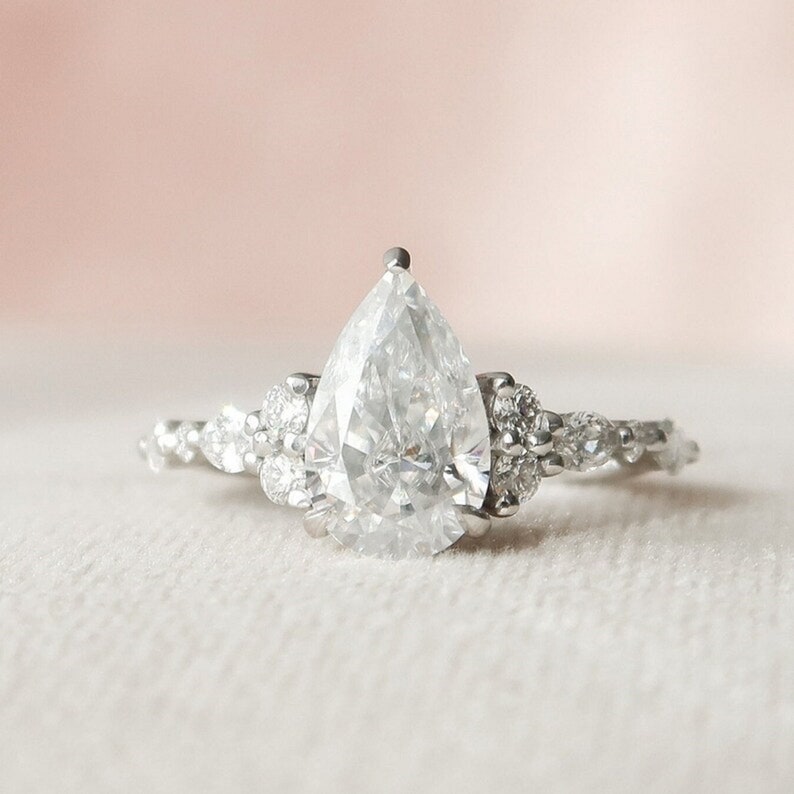 2.01 Ct Pear Moissanite With Marquise & Round Engagement Ring