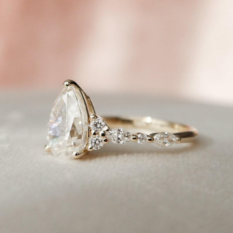 2.01 Ct Pear Moissanite With Marquise & Round Engagement Ring