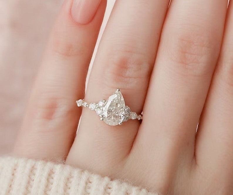 2.01 Ct Pear Moissanite With Marquise & Round Engagement Ring