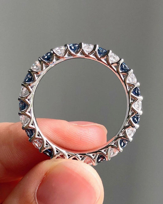 1.40 Ct Brilliant Round Moissanite With Blue Sapphires Eternity Band