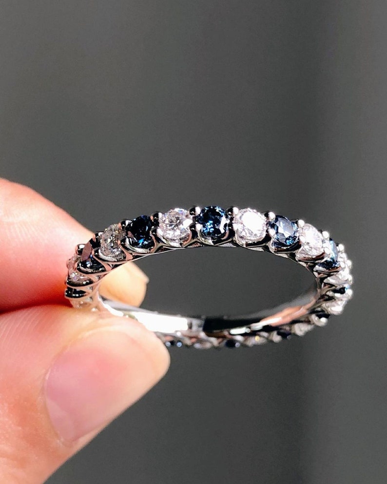 1.40 Ct Brilliant Round Moissanite With Blue Sapphires Eternity Band