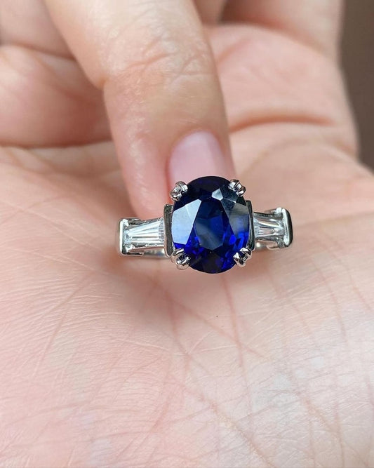 2.0 Ct Blue Oval With Tappers In Side Engagement Ring