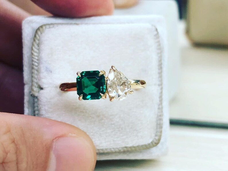 1.0 Ct Pear Moissanite With Green Asscher Two Headed Ring